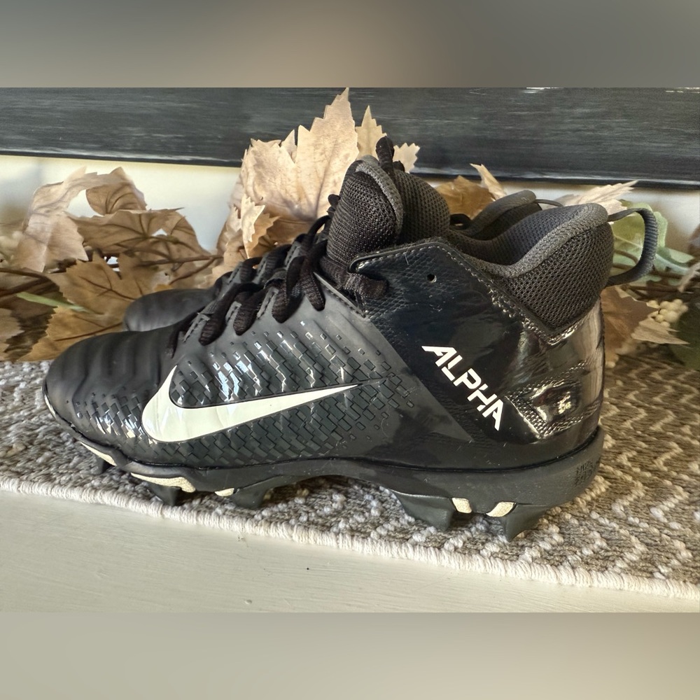 Nike Kids Black and White Alpha Cleats.